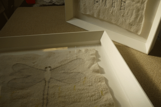 Custom frames finished in gesso with painted finish.