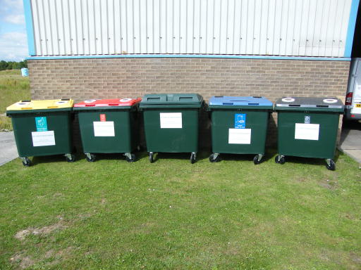 Recycling bins with colour coded lids.