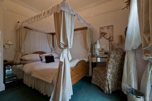 Small 4 poster room with balcony. Private shower room.
