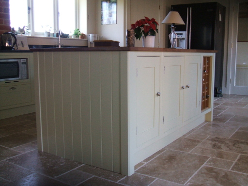 Painted island with wine rack.