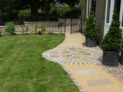 Indian paving circle and pathway with new turf
