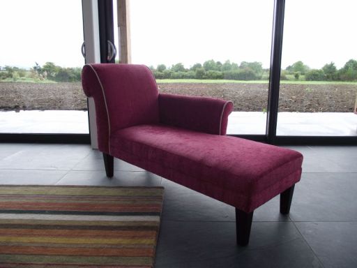Chaise Longue, covered in a pink velvet with cream velvet piping.