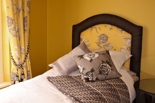 Headboard with pleated rolled edge: Fabric by Sanderson