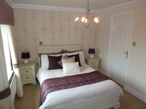 Interior design bedroom designed in creams and aubegine