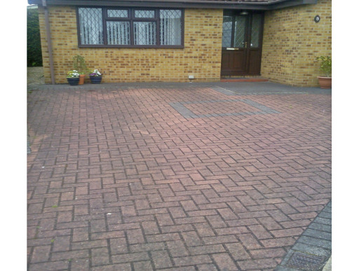 A block paving driveway before cleaning