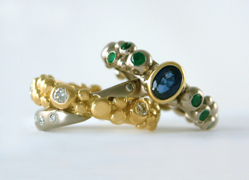 Yellow and White gold diamonds, sapphires and emerald bespoke wedding and engagement rings