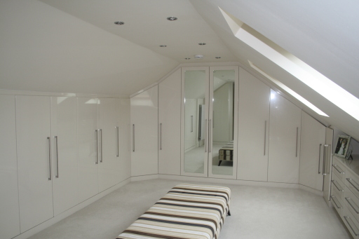 Cream gloss bespoke fitted attic bedroom/dressing room