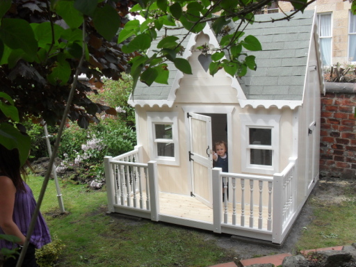 Victorian wooden bespoke playhouses lined two story