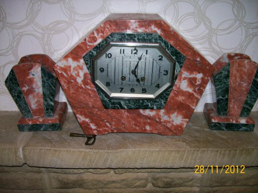8 day Strike Clock with side items
