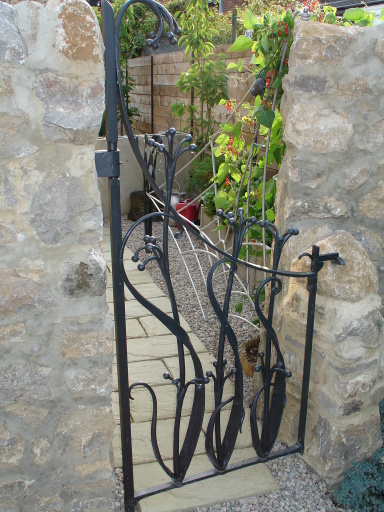 organic style seed pod side gate,hand forged and blacksmith made