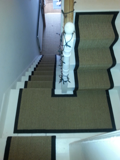 Bound sisal runners to stairs &amp; landing