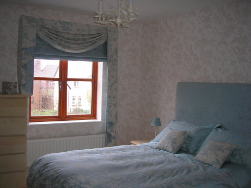 silk roman blind, swag and tail detail , matching headboard