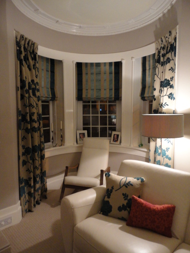 Hand pleated dress curtains and co-ordinating roman blinds using Laura Ashley fabrics