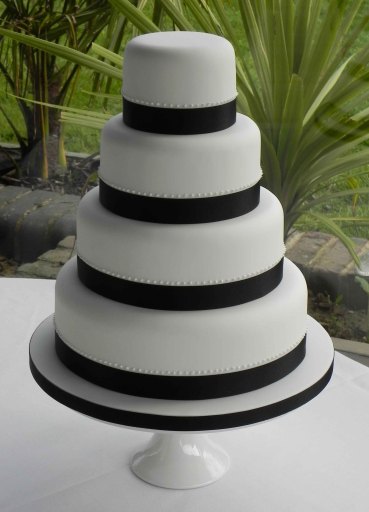 Four tier black and white wedding wedding cake - easily modified to match your wedding scheme