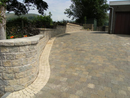 Block paving driveway with co-ordinated walling