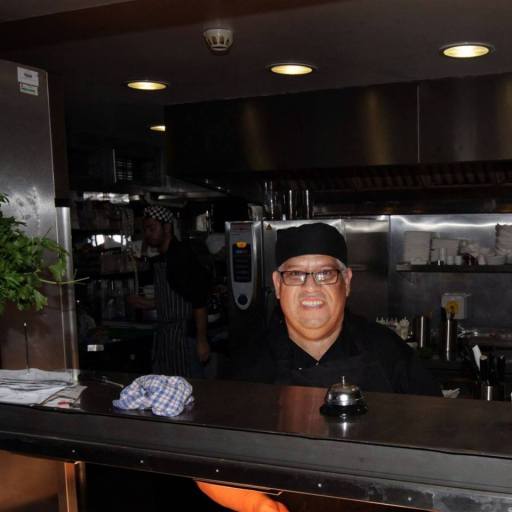 Alfonso cooking traditional Peruvian food