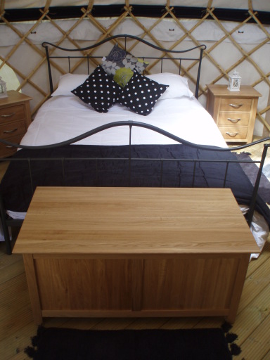 King sized bed in yurt