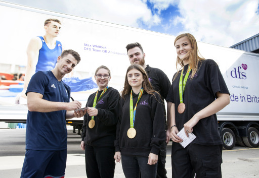 Max Whitlock signs autographs for employees at a DFS facility.