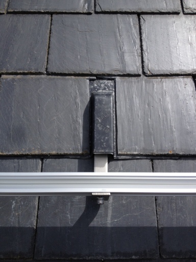Solar PV mounting bracket and flashing for slate roofs.