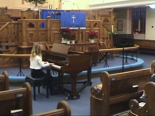 Young pupil playing in annual concert.