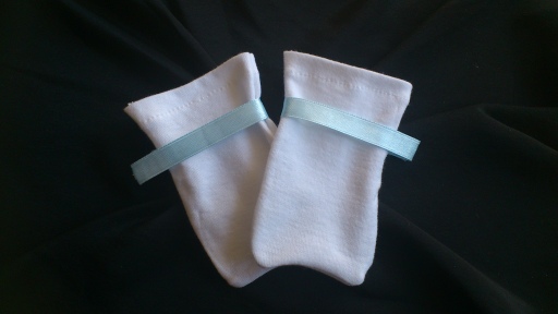 White mitt with a Baby Blue Ribbon