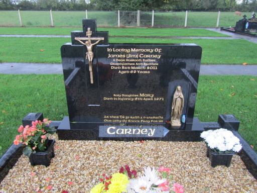 BLACK GRANITE HEADSTONE WITH BRONZE CROSS AND STATUE