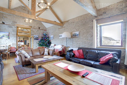 lounge featuring gritstone fireplace and plenty of seating