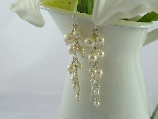 Long, dangly pearl earrings, made with Swarovski pearls