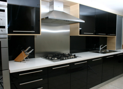 Black gloss doors and Minerelle worksurfaces