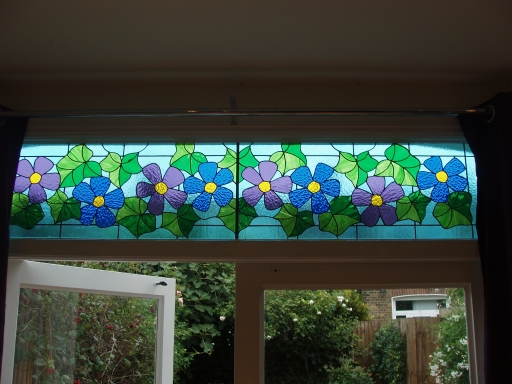 pretty window above French doors to the garden