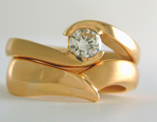 Shaped handmade gold wedding and engagement rings remodelled from clients existing jewellery
