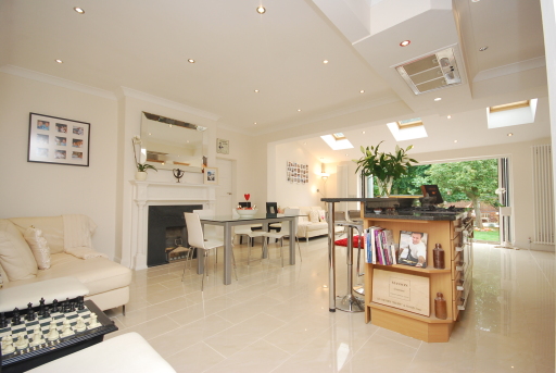 Extension with a contemporary finish whilst maintaining the original features such as the fireplaces