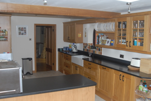 Traditional Solid Wood, Black granite worktops, Designed and Installed by us