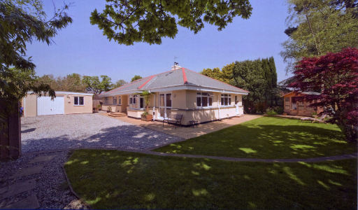 This spacious bungalow was designed and built on an end of garden plot.