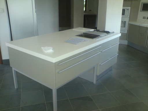kitchen island unit complete with a corian glacier white worktop