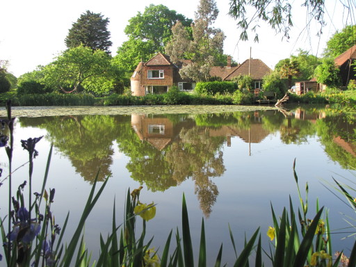 Wimbles Oast from across the lake