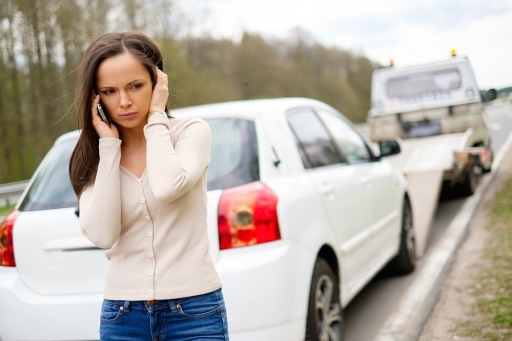 Woman calling roadside assistance