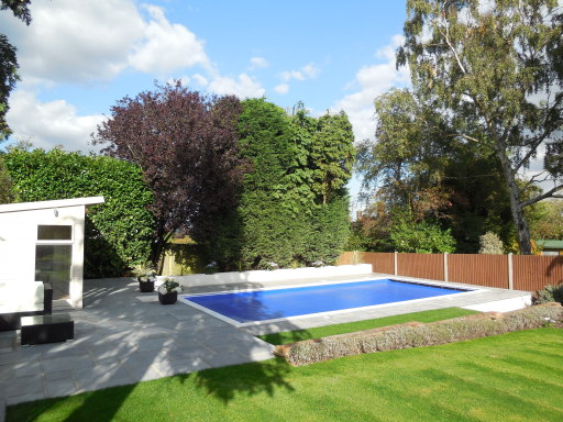 Concrete mosaic swimming pool with LED lighting and Certikin CoverStar Safety cover