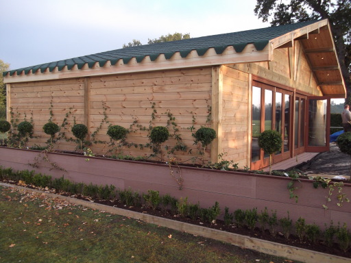 One of our own designed bespoke timber swimming pool cabins &amp; composite decking
