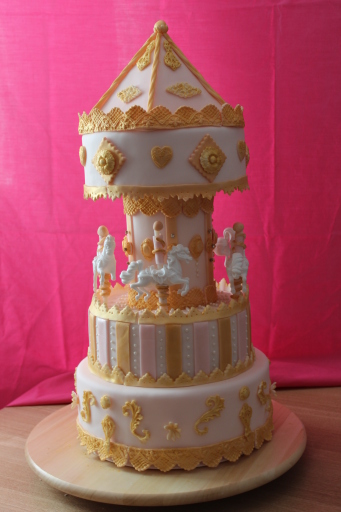 Carousel cake in pink and gold