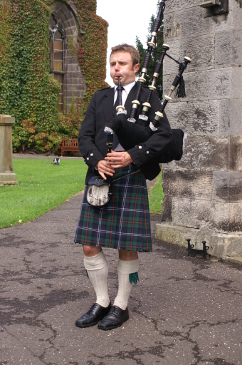 Alex piping at a church