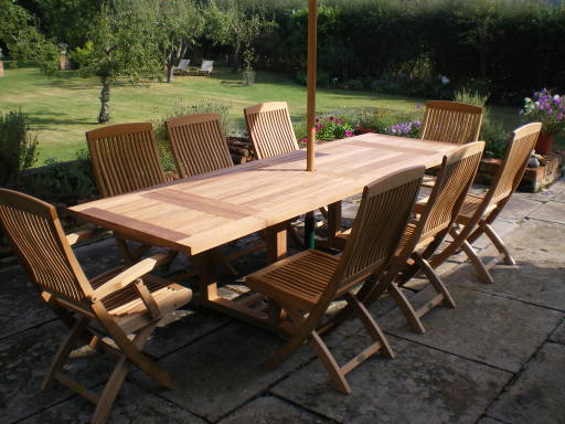 Solid Handmade Hart Teak Table with Wynyard folding Teak Armchairs