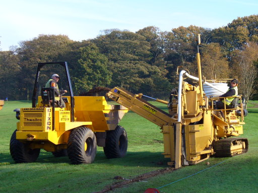 Installation of main drain across golf course using the sportsfield trencher