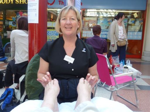 Reflexology soothing a client!