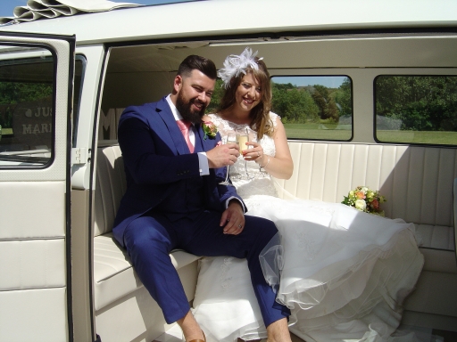 Champagne time in VW split screen camper withe her fab sunroof Silk and satin Weddings Northampton