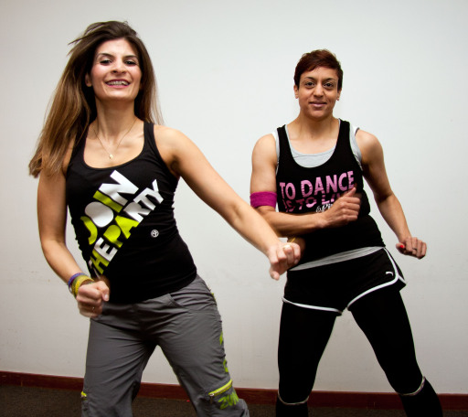 Shy Bux (right) dropped from size 22 to 10 dancing with Zumba instructor Ellena Brooks.