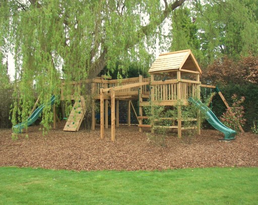 Residential play tower constructed around a willow tree in Esher, Surrey
