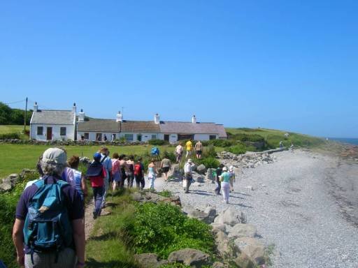 Walkers going from Moelfre towards Lligwy, east coast Anglesey.