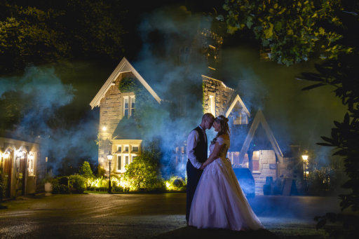 Bride and groom at the West Tower with smoke bombs