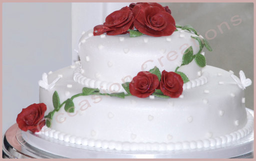 Beautiful bespoke wedding cake - trailing red sugar roses